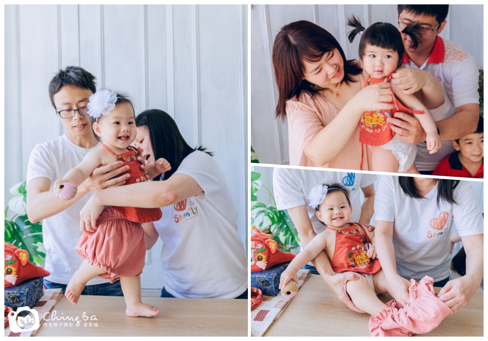 父母幫周歲寶寶穿虎衣